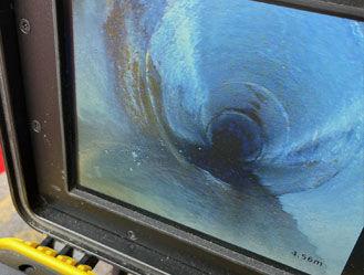 CCTV camera view further down the pipe, checking for cracks, blockages, or other drain issues.