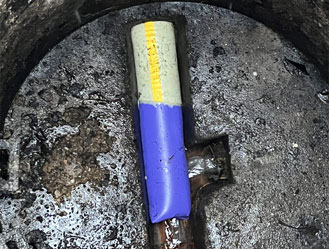 Freshly installed liner expanding and bonding to the inside of the old pipe.